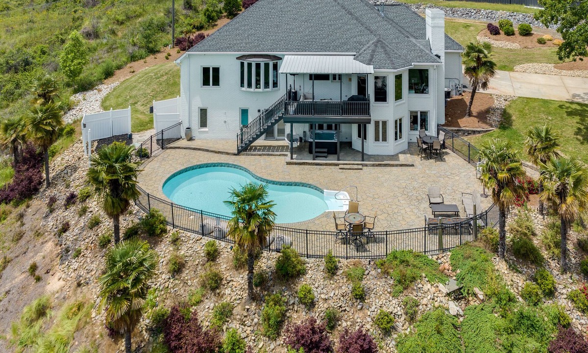 India Hook House | Beautiful Waterfront Home with abundant outdoor seating, pool, hot tub, grill
