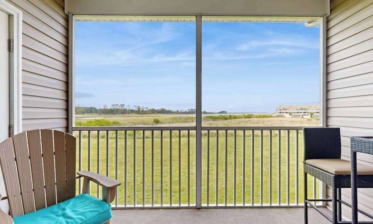 Ocean View Condo | Bethany Bay condo with bay views, athletic courts, pool, fireplace, & balcony