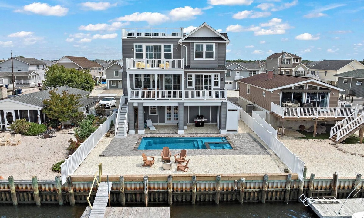 Mystic Island House | Brand New, Waterfront Beach Oasis with Heated Pool, Hot Tub, & Dock close to LBI