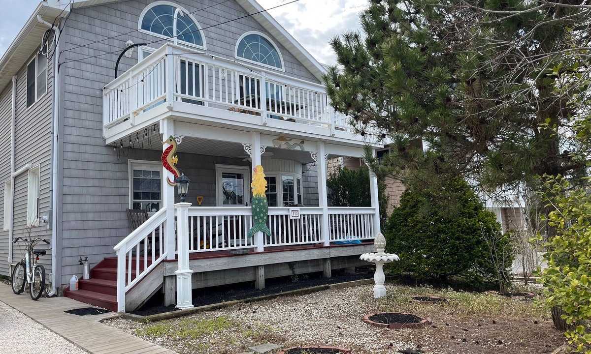 Ship Bottom Apartment | Cozy 2 bedroom Apartment Half block to beach, Front deck, Fenced in backyard.