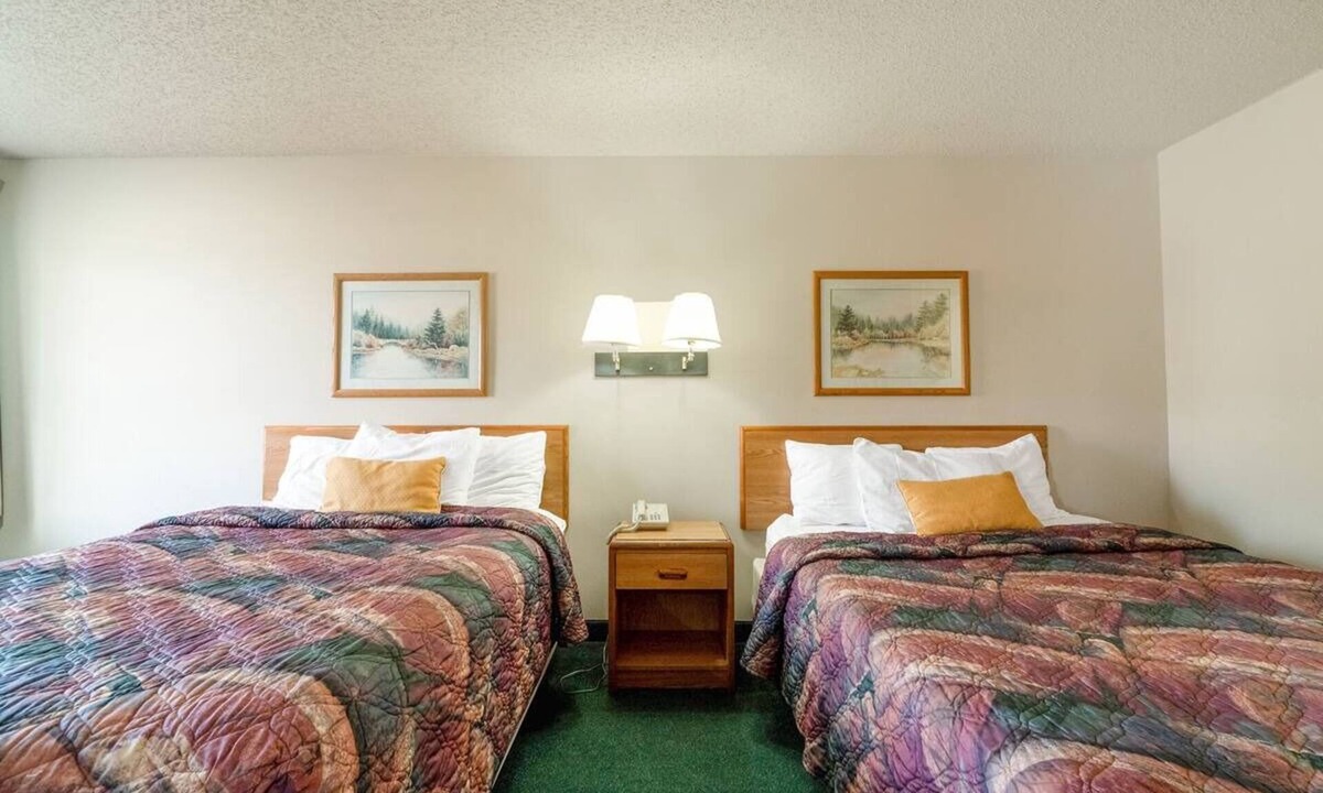 Texhoma Hotel | Inviting Two-Queen Room Conveniently Close to Dining Spots