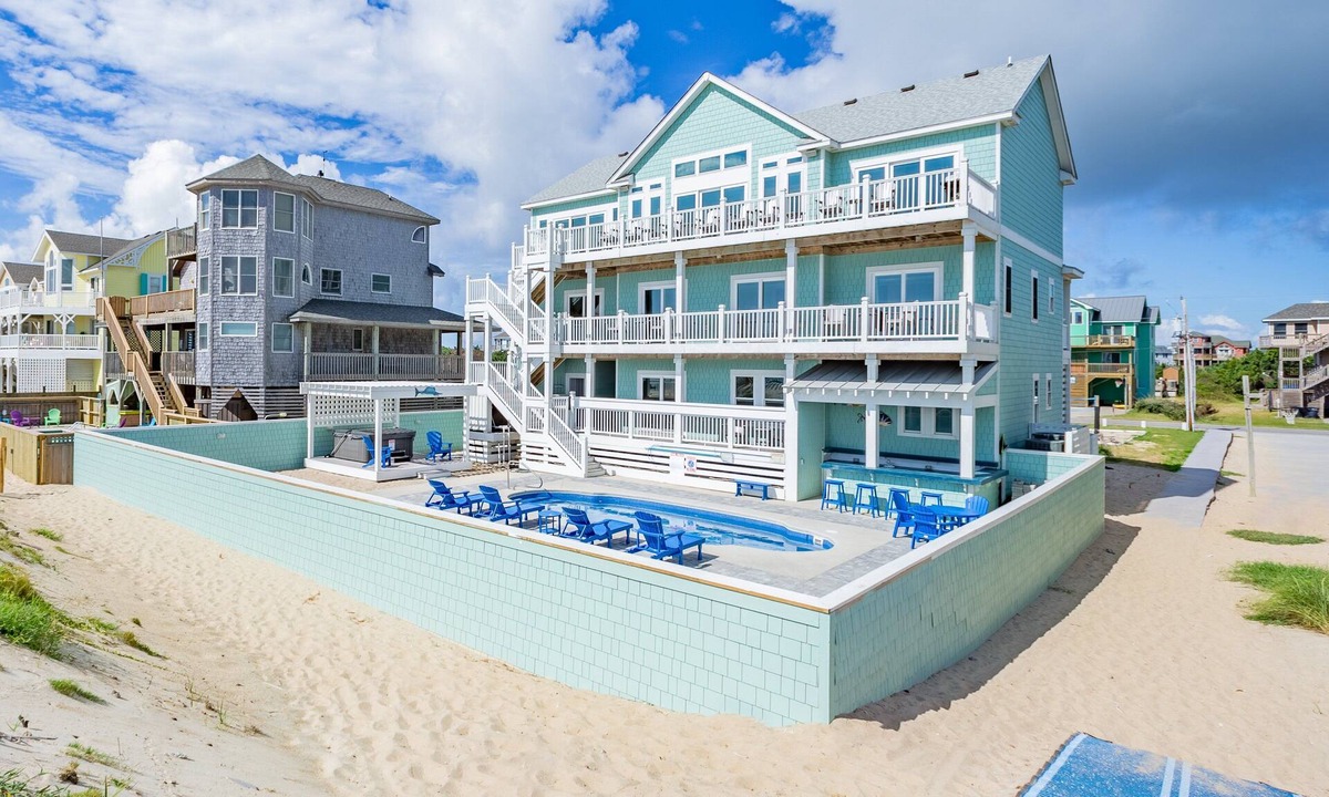 Avon House | Lovely beachfront home with hot tub, pool, game room, & central AC