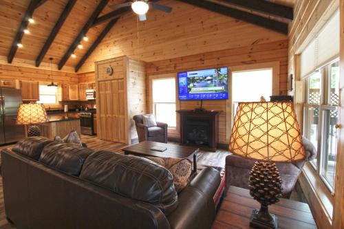 Bryson City Villa | Magical Memories Brand New Veranda Level Cabin Overlooking Pond in Heart of Bryson City