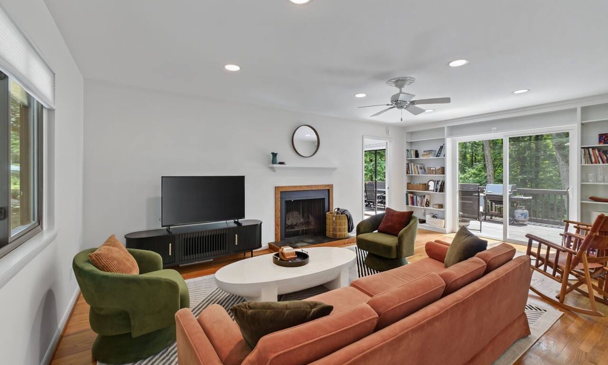 Charlottesville House | Settle into this stylish 4 bedroom, 3.5 bath midterm rental, thoughtfully designed with a warm midcentury modern vibe. Enjoy two primary suites, generous storage, a spacious deck, covered porch and private wooded backyard.
