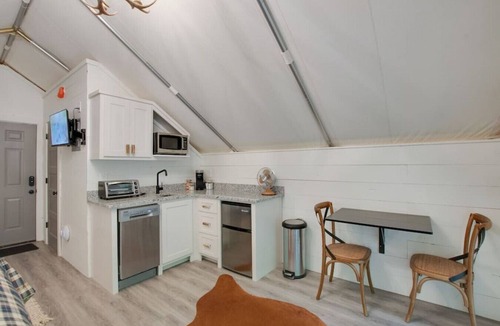 Groveoak RV Rental | #10 The Lodge Luxury Glamping Tent Hunting Theme