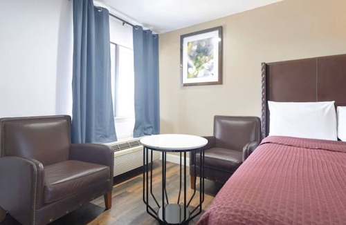 San Augustine Hotel | 2 Rooms for Great Value: 2 Full Beds Non-Smoking for 4 Guests.