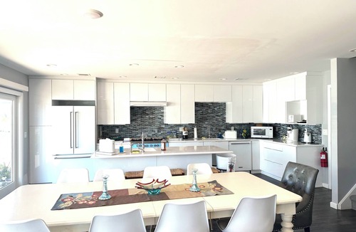 Normandy Beach House | 4 bedroom beach home- lagoon front deck, fantastic sunset views, pet friendly,