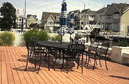 Normandy Beach House | 4 bedroom beach home- lagoon front deck, fantastic sunset views, pet friendly,