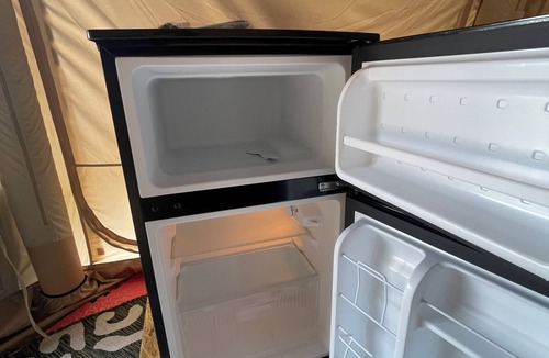 Merritt RV Rental | Air conditioned Glamping Tent overlooking a beautiful orchard