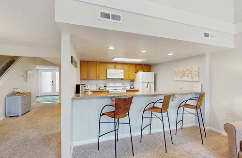 Ocean Ridge Condo | Beautiful home with natural light, lagoon views - Community Hot tub & Pool