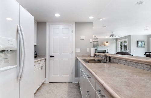India Hook House | Beautiful Waterfront Home with abundant outdoor seating, pool, hot tub, grill