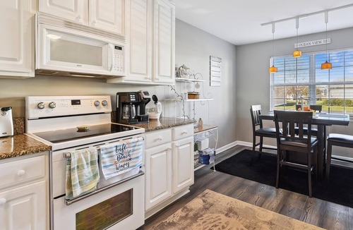 Ocean View Condo | Beautifully decorated 1st floor unit nestled within unspoiled land and gently lapping inland waterways -