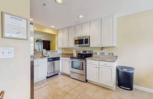 Ocean View Condo | Bethany Bay condo with bay views, athletic courts, pool, fireplace, & balcony