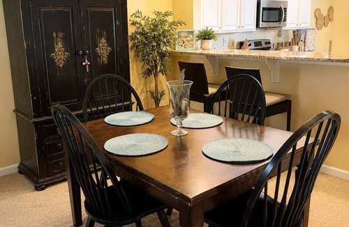 Ocean View Condo | Bethany Bay condo with bay views, athletic courts, pool, fireplace, & balcony