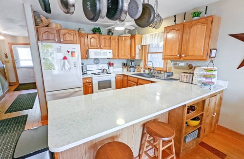 Piney Island House | Channel Watch | Assateague Channel Waterfront w/Private Dock, Screened Porch, Balconies & Sunrises