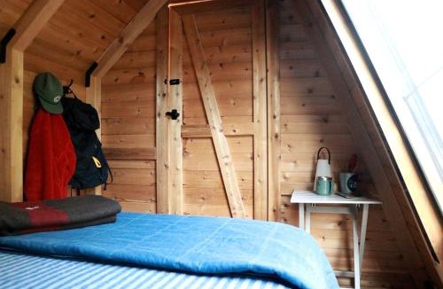 Allen County Ski Chalet | Charming A-Frame Cabin Experience with Campfire Vibes in Humboldt, Kansas