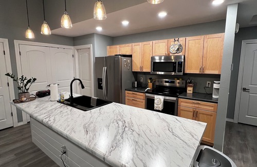 Joplin House | Charming home with firepit, large fenced yard, pet friendly.