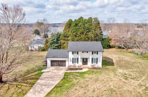 Crouse House | Charming house in a golf course community with lake views and a big yard.