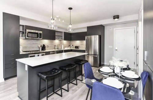 Crystal City Apartment | City View 2BR Retreat with Rooftop, Gym & Parking
