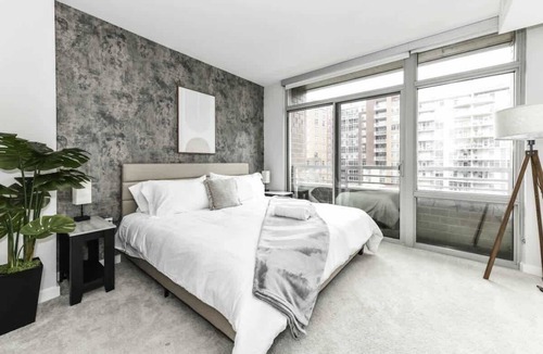 Crystal City Apartment | City View 2BR Retreat with Rooftop, Gym & Parking
