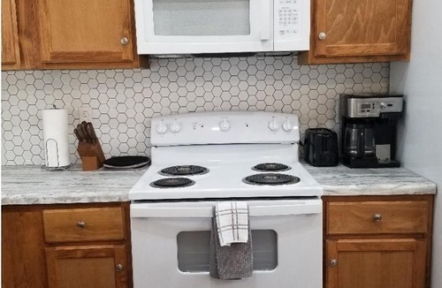 Phenix City Ski Chalet | Cozy Spacious Cottage with deck and grill