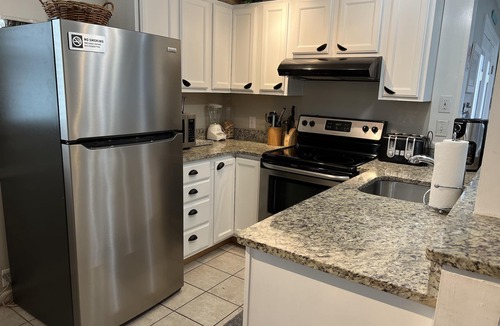 Rehoboth by the Sea Condo | Dog-Friendly 2-floor Dewey Beach condo, steps away from beach, sleeps 10