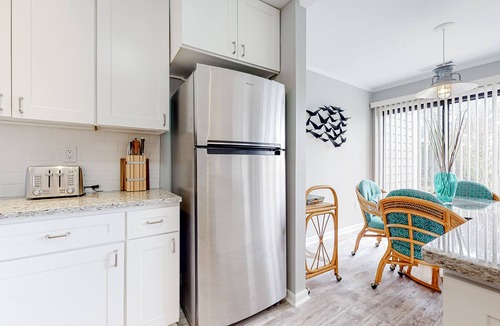Fenwick Island Condo | East of the Sun condo with screened porch, fast WiFi, W/D, AC, and pool