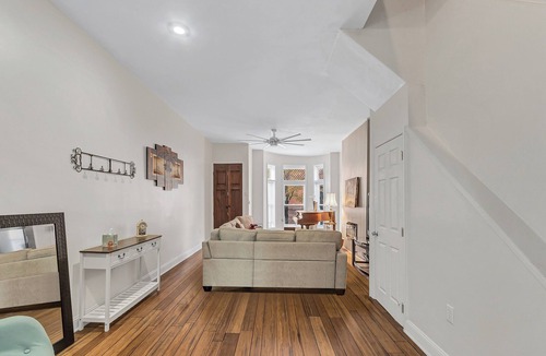 Old Goucher House | Elegant 3 bedroom Row Home Beside the Park High Ceilings, Natural Light & Views.