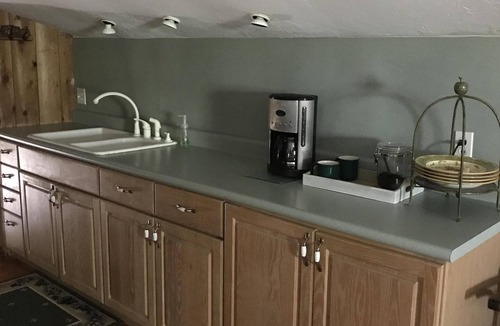 Edmond Cabin | Enjoy our loft with a private hot tub overlooking the vineyard and pond.