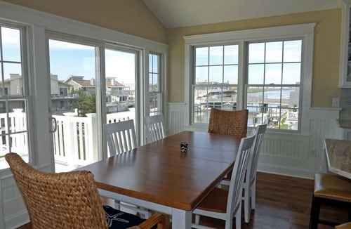 Avalon Condo | Enjoy the beautiful bay and sunset views from this top floor condo