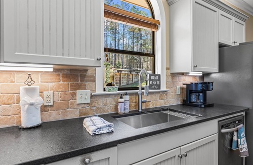 Little Kowaliga House | Escape to this stunning 6 bed, 5 bath lakefront home, perfect for large groups & family getaways. With space to sleep up to 20 guests, this home features expansive indoor living areas & breathtaking lake views throughout.