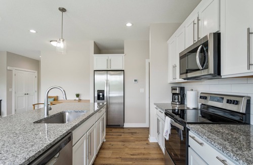West Des Moines House | Exclusive Scenic Escape End Unit New Construction Jordan Creek w/2 Car Garage