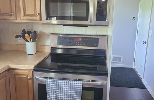 West Omaha House | Executive Rental - 4 bed, 4 bath fully furnished home W/L2 EV Charging Station