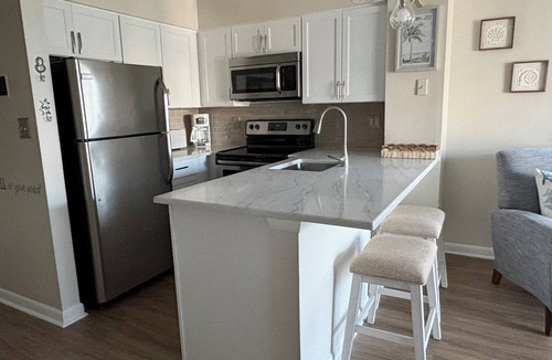 North Ocean City Condo | Hidden Harbor - canal front 1st floor condo with balcony, shared pool, next to Northside Park.