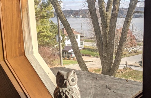 Le Claire Cottage | Historic Cottage in LeClaire w/full river views and 3 decks. Dogs welcome