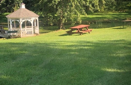 Lovettsville House | Historic Milk House Cottage Pond with Fire pit