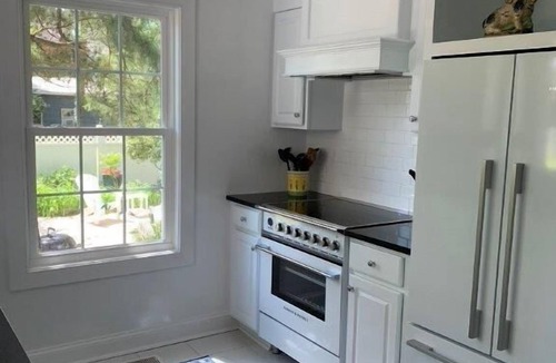 The Pines Cabin | Historic Pines Cottage Sleeps 10 – Walk to Beach, Porch, Patio, and Charm!