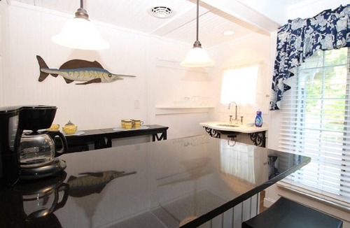 The Pines Cabin | Historic Pines Cottage Sleeps 10 – Walk to Beach, Porch, Patio, and Charm!