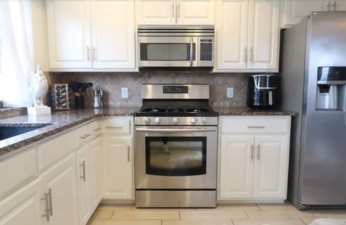 Central Oklahoma City Villa | Historic Villa🚶1 min from Lake Hefner🏊 Hot Tub 🎱Pool Table🐶Friendly🎣Fishing