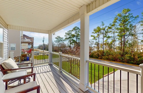 Hampstead House | Idyllic retreat with surfboards, hot tub, open layout, & firepit - dog-friendly