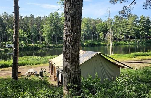 St Croix Falls RV Rental | Incredible Tented Cabin Ideal for Glamping with Fireplace and Barbecue in Saint Croix Falls, Wisconsin