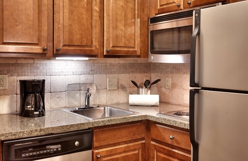 Omaha Condo | King Suite. Free Breakfast. Pool. Gym. Great for Business Travelers!