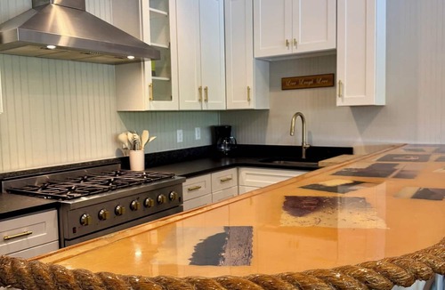 Alexander City House | Lake front & pool front with two boat slips, playground, grill station & canoes.