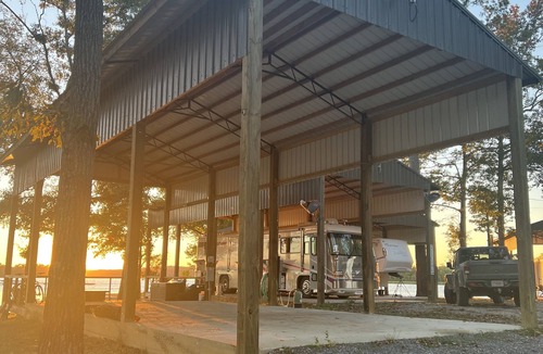 Lincoln RV Rental | Lakeside Comfort: Covered RV Site with Private Pier #1