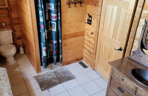 Hulett House | Large garage for bikes. Beautiful log home. On golf course.