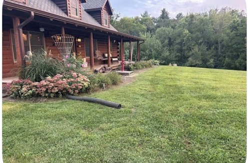 Highland Center House | Log cabin home in charming setting