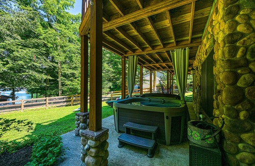 Bumpass Cabin | Luxurious lakefront cabin with hot tub, game room, & washer/dryer- dog friendly