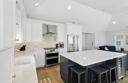 North End Condo | Luxury 5BR/4BA with Elevator, Garage, Spacious Porches and Full Linen Service!