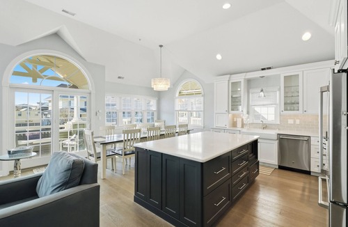 North End Condo | Luxury 5BR/4BA with Elevator, Garage, Spacious Porches and Full Linen Service!