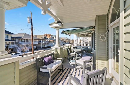 North End Condo | Luxury 5BR/4BA with Elevator, Garage, Spacious Porches and Full Linen Service!